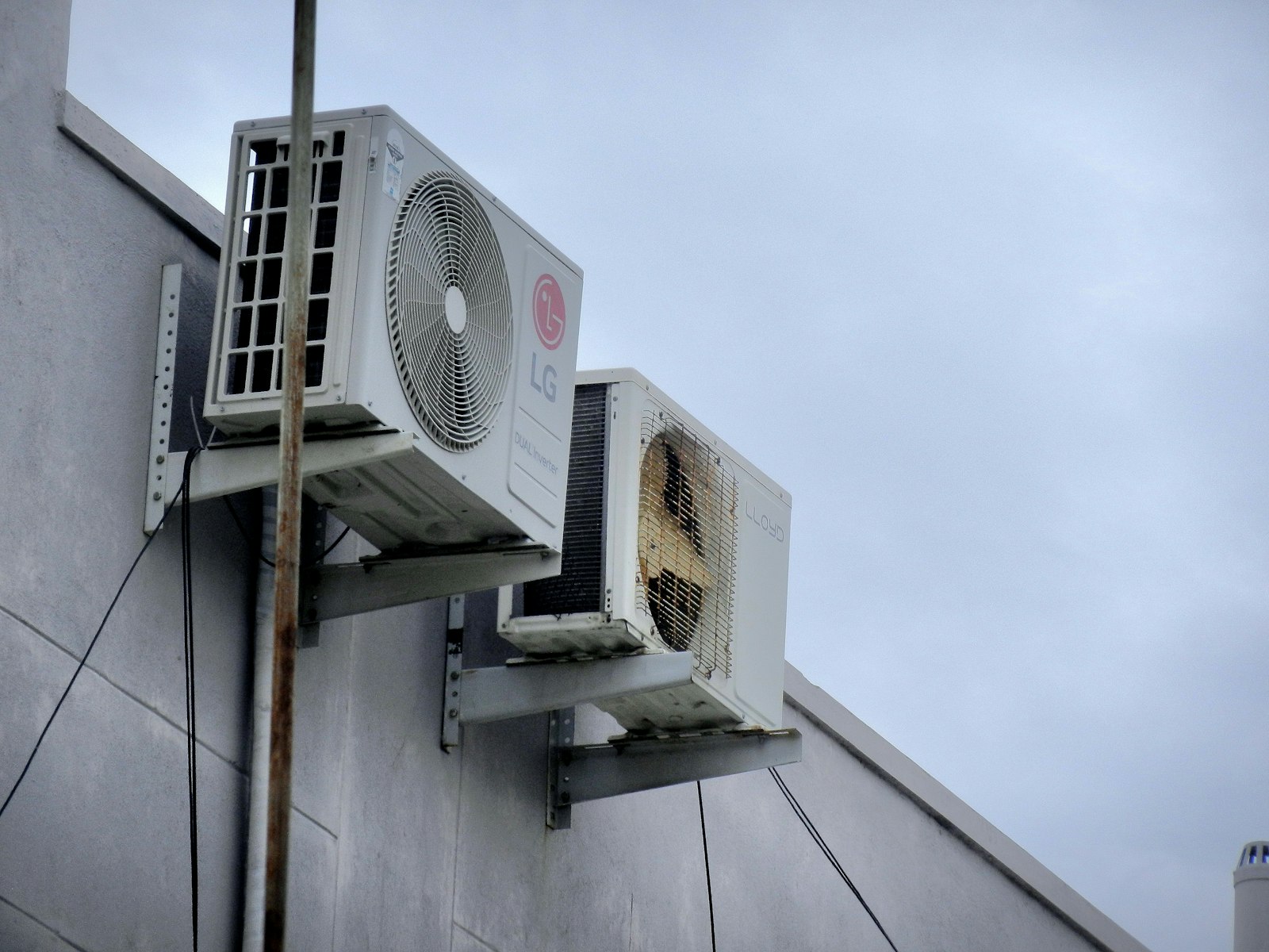 Outdoor split system unit installed in a residential backyard