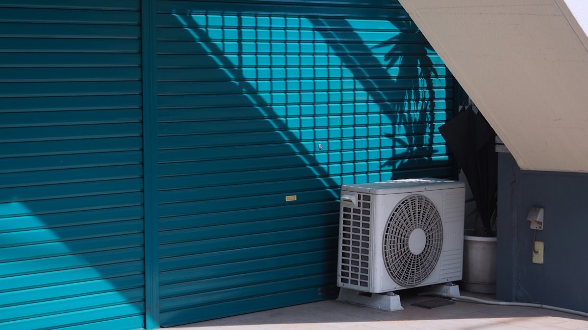 Outdoor air conditioning unit installed beside a residential building