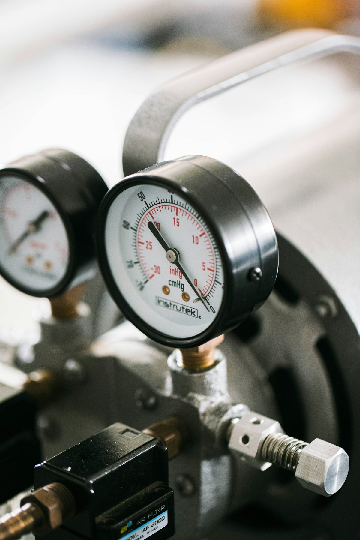 Technician checking air conditioning system pressure